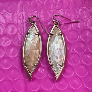 Kendra Scott earrings: MOP with brushed gold. About 1.5  inches long EUC